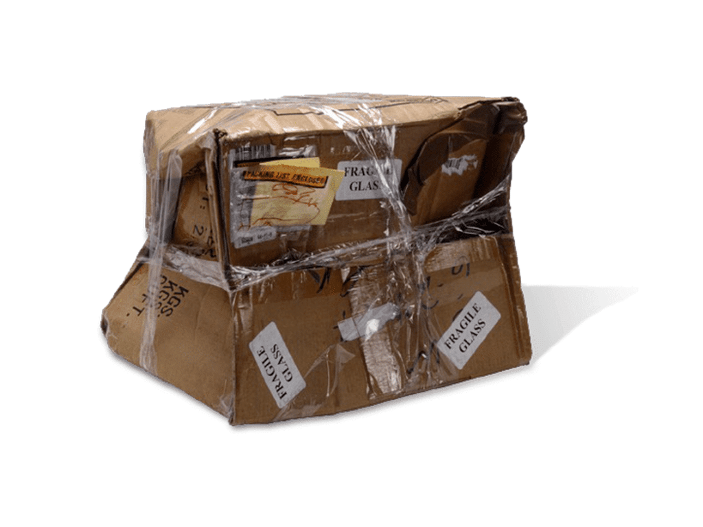 A damaged box covered in tape and transit stickers