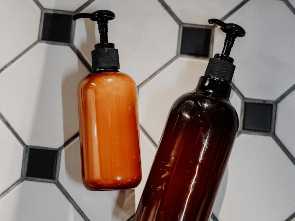 Small pump containers lying on a tiled floor