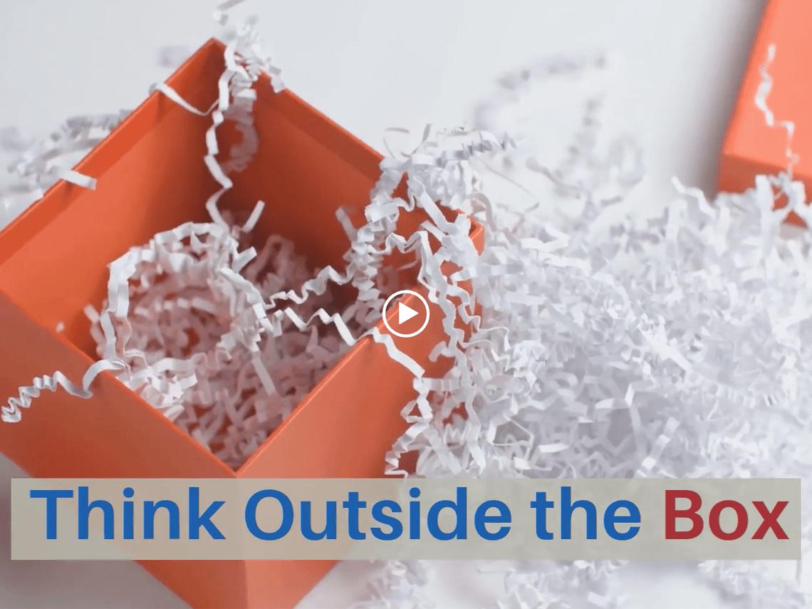 An orange box filled with paper filling with the caption "Think outside the box"