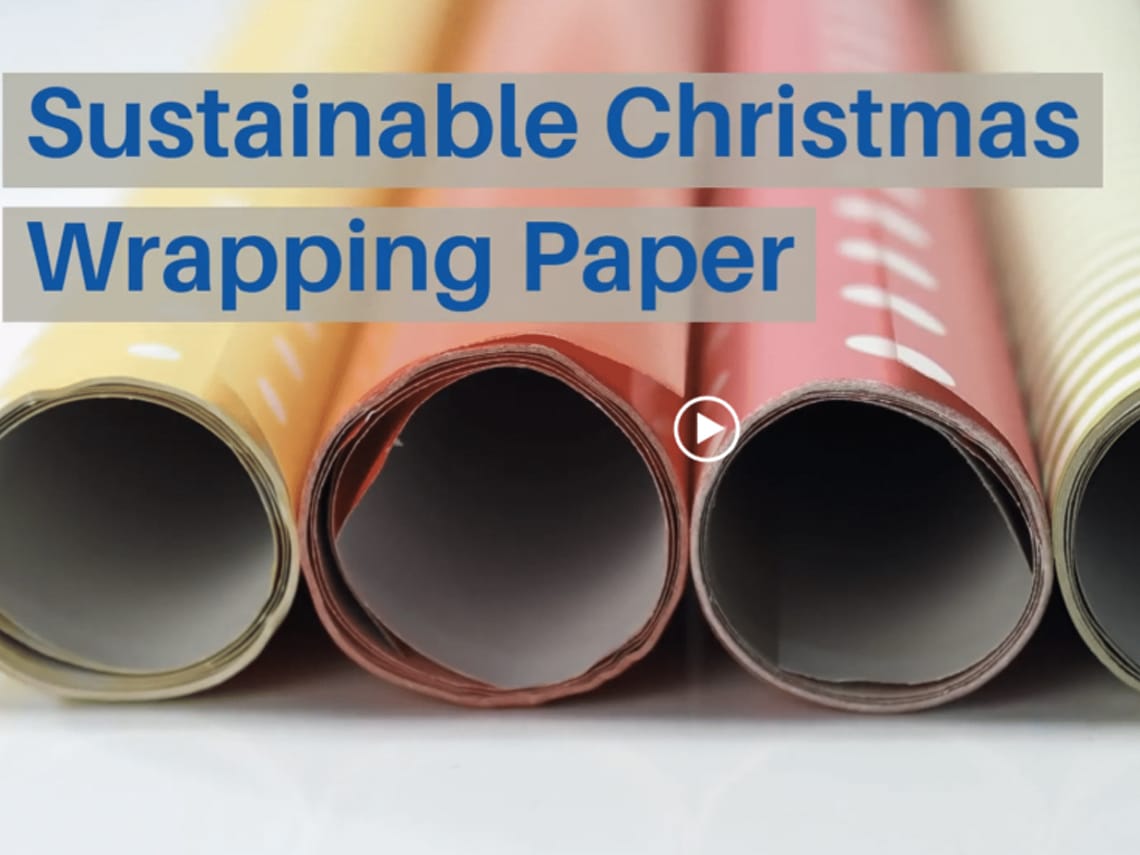 A close up of rolls of wrapping paper with a caption "Sustainable Wrapping Paper"