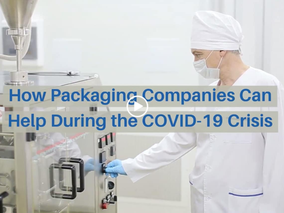 A worker is constructing medical packaging at a machine