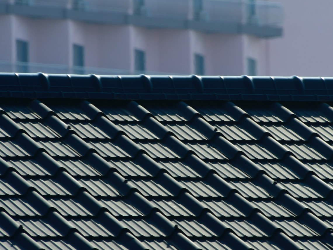 solar tiles on the roof of a house in the sun