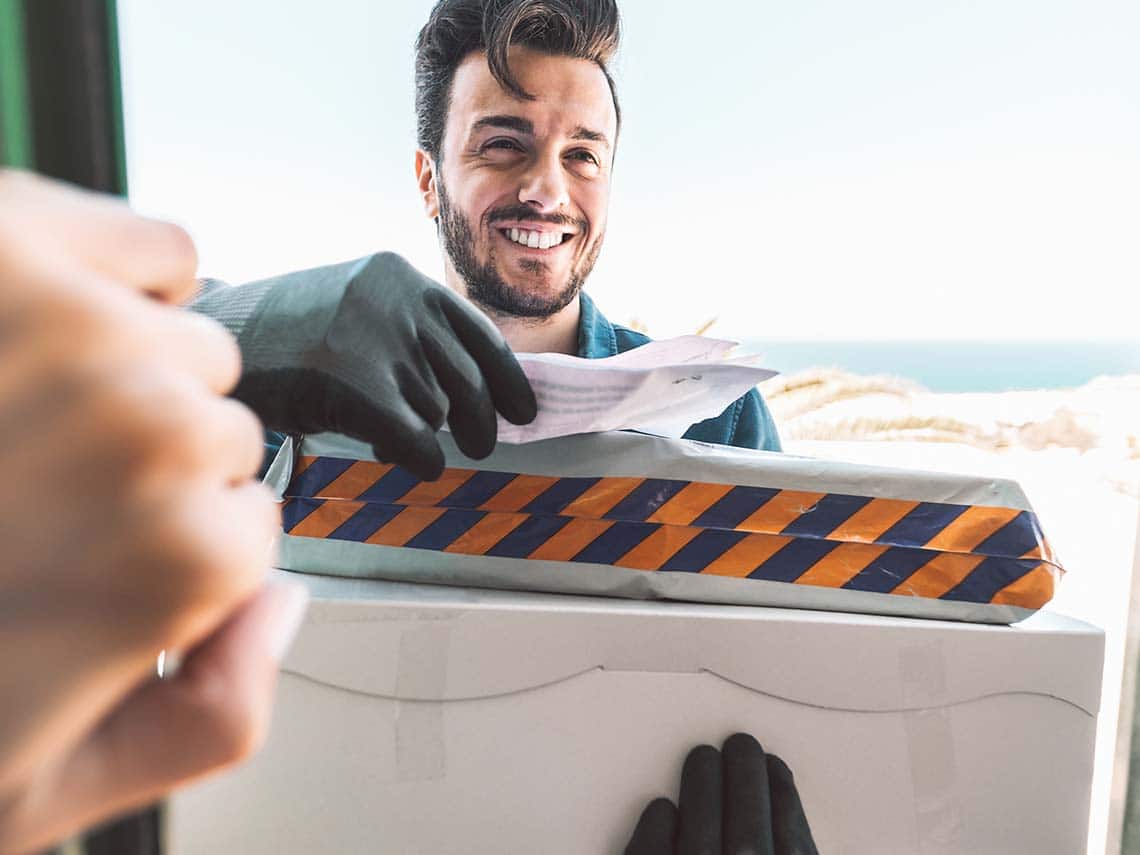 Man handing over eCommerce Packaging